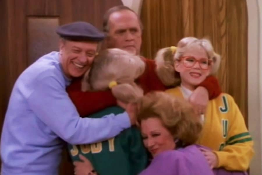Henry hugging the twins, along with neighbors Smitty and Iron