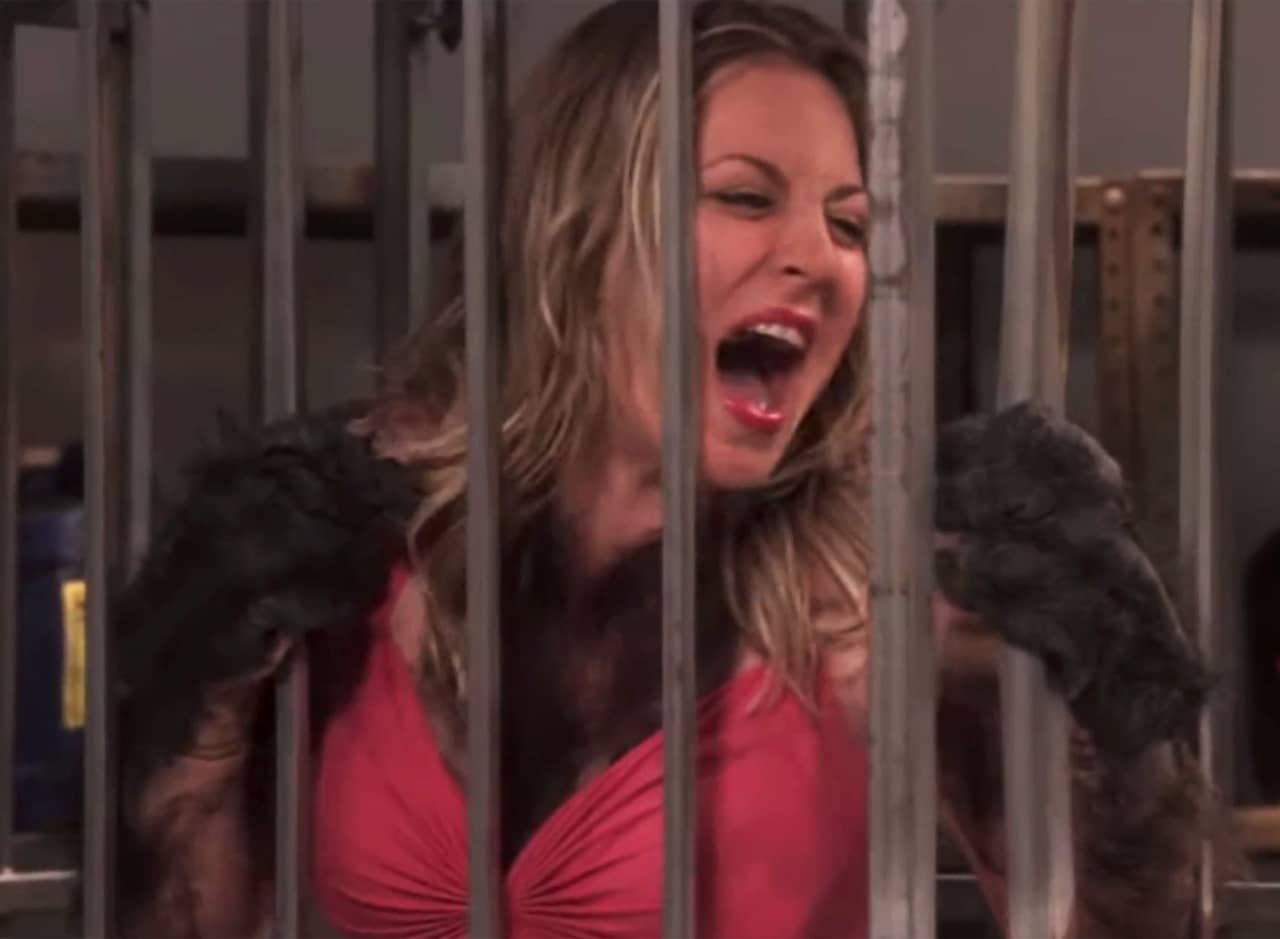Penny, covered in gorilla hair, screams in a cage