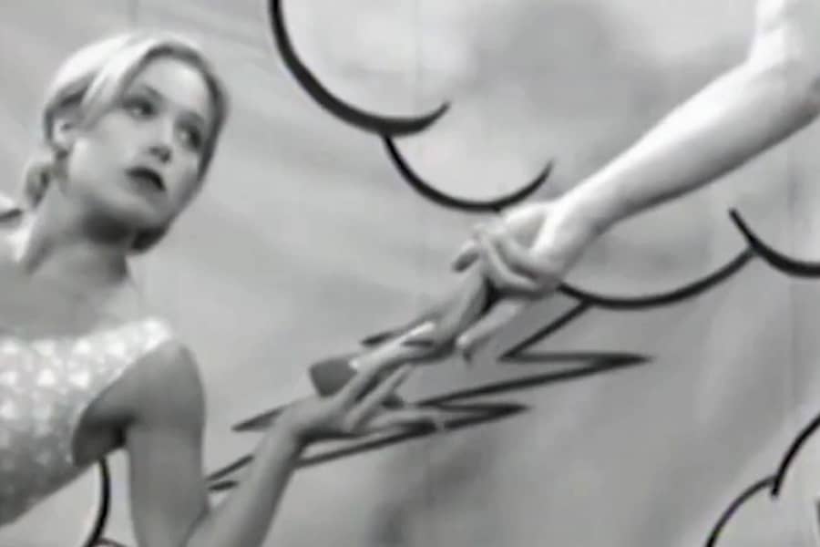 Kelly Bundy accepting a shoe from the hand of God