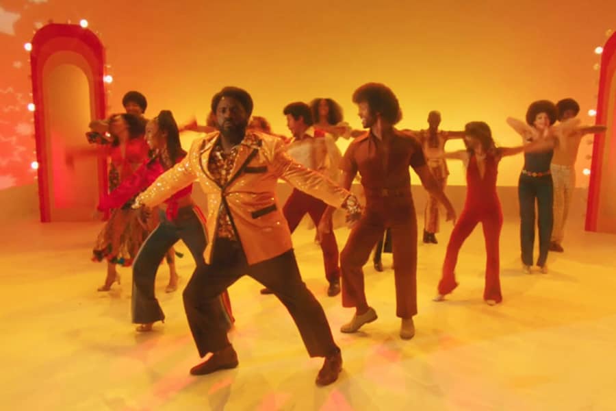 Sherman dancing with a group of backup dancers