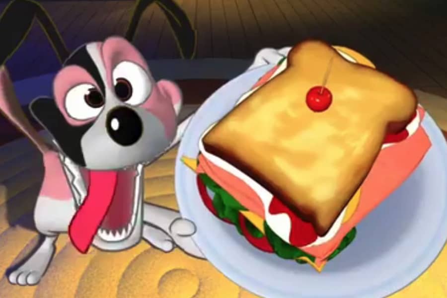 dog holding up a sandwich