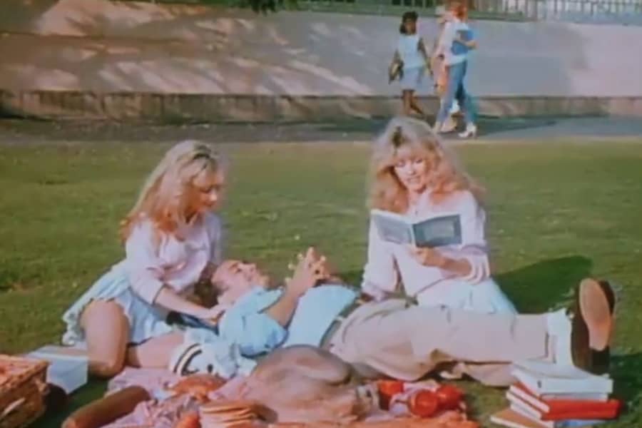 Hubble lounges on the lawn with Kim and Misty, two blonde twins