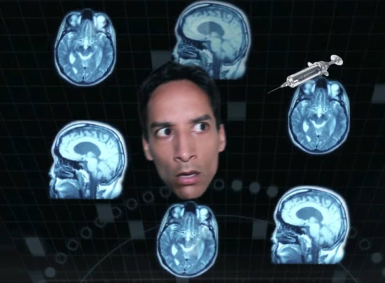 Abed’s head surrounded by MRI scans and a syringe