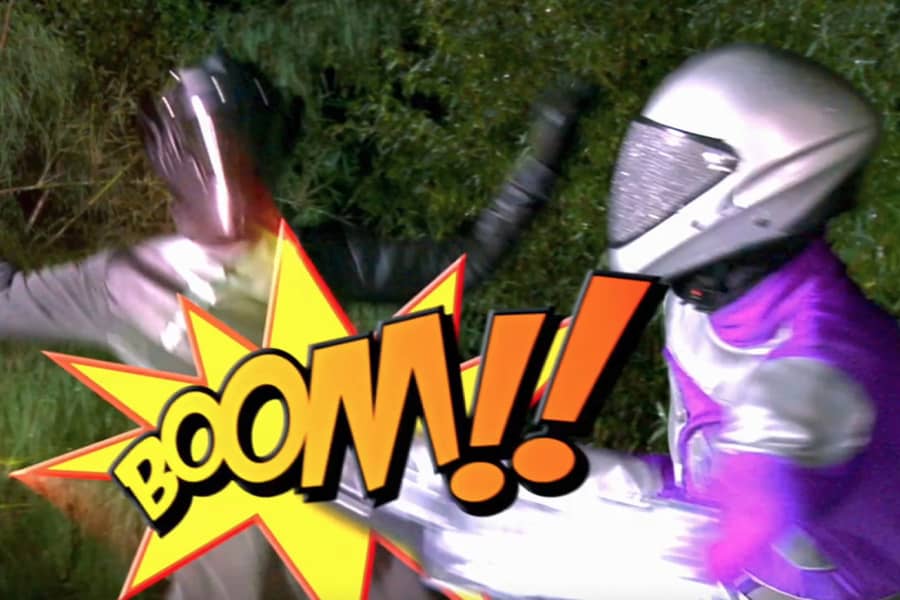 purple trooper kicking a Dorlock with a “Boom!” graphic