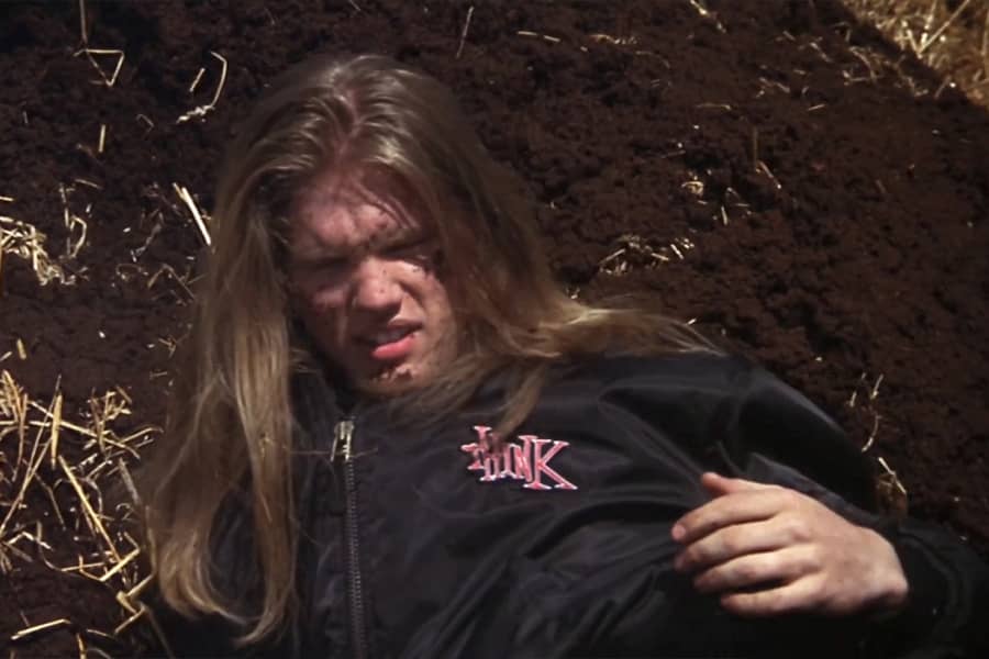 biker guy covered in dirt and manure