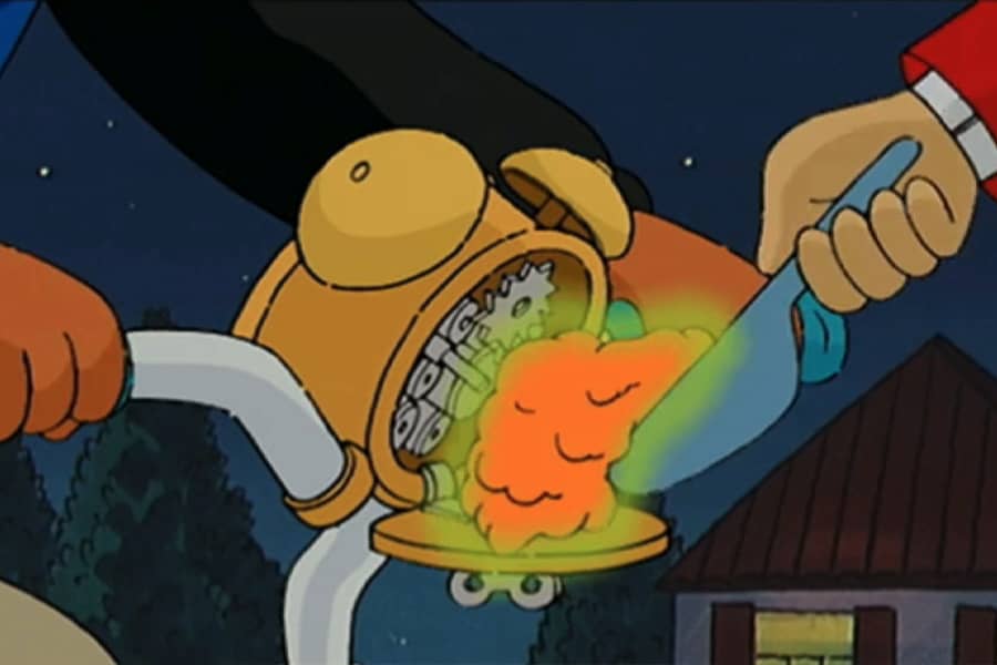 glowing uranium being scooped into the alarm clock on the bike