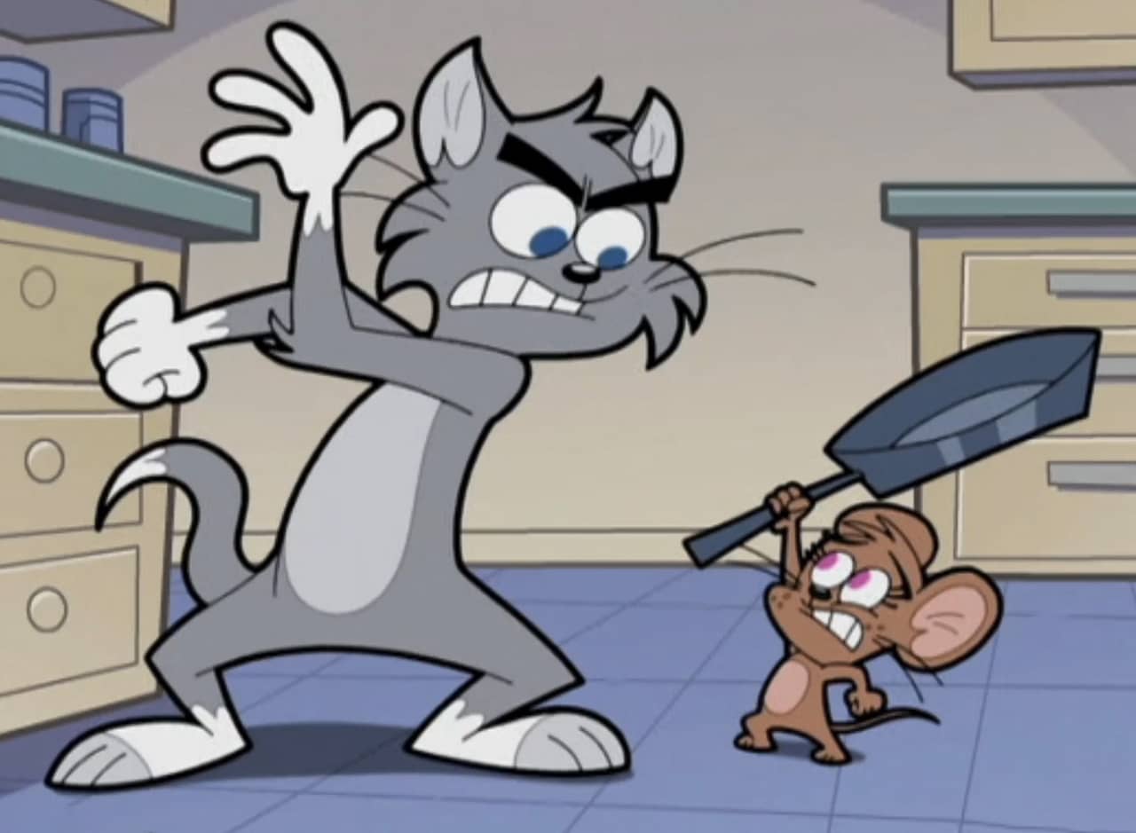 Sleazy, a cat, and Cheezy, a mouse in a kitchen; Cheezy is holding a frying pan