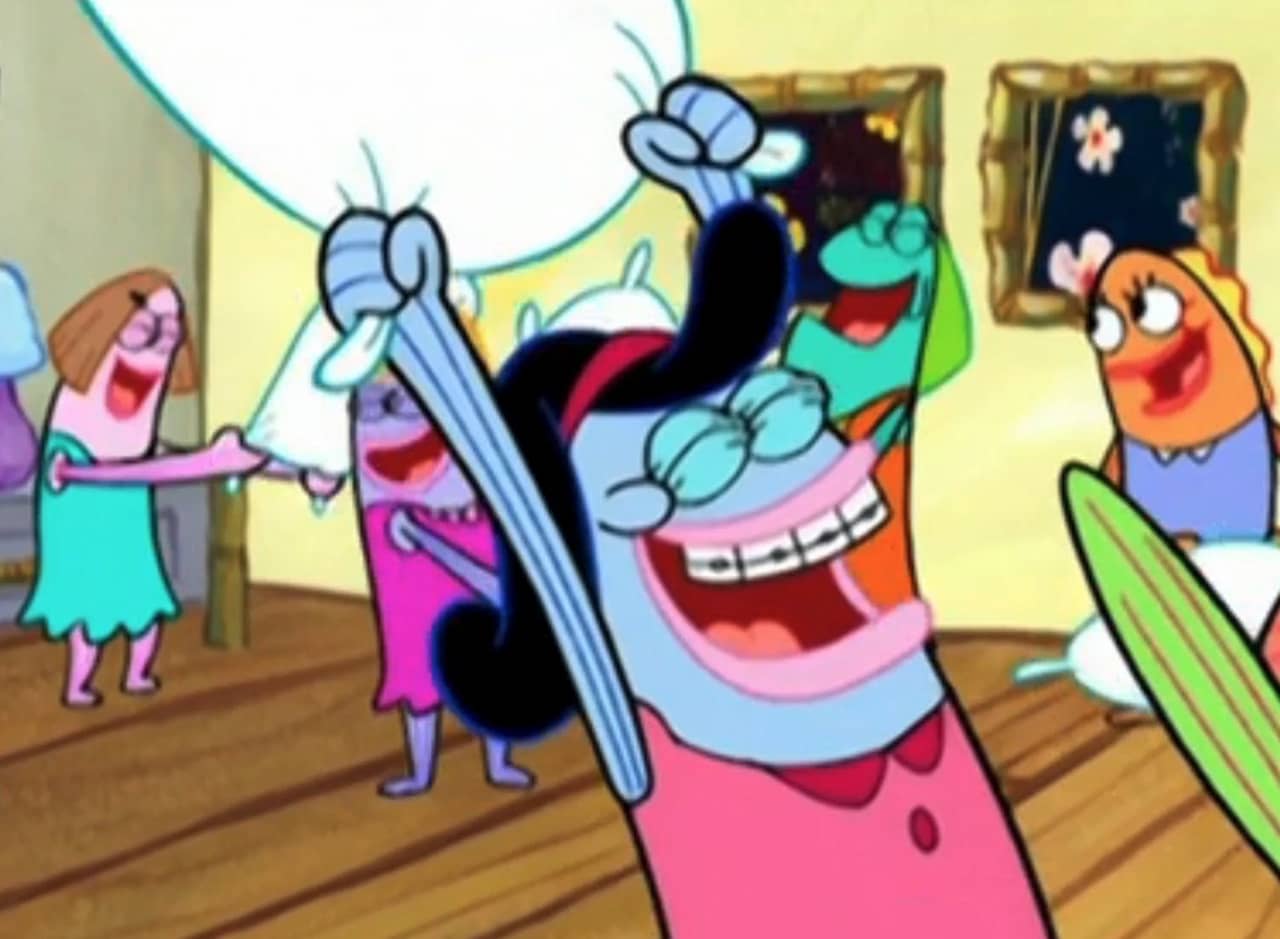 teen girl fish pillow fighting