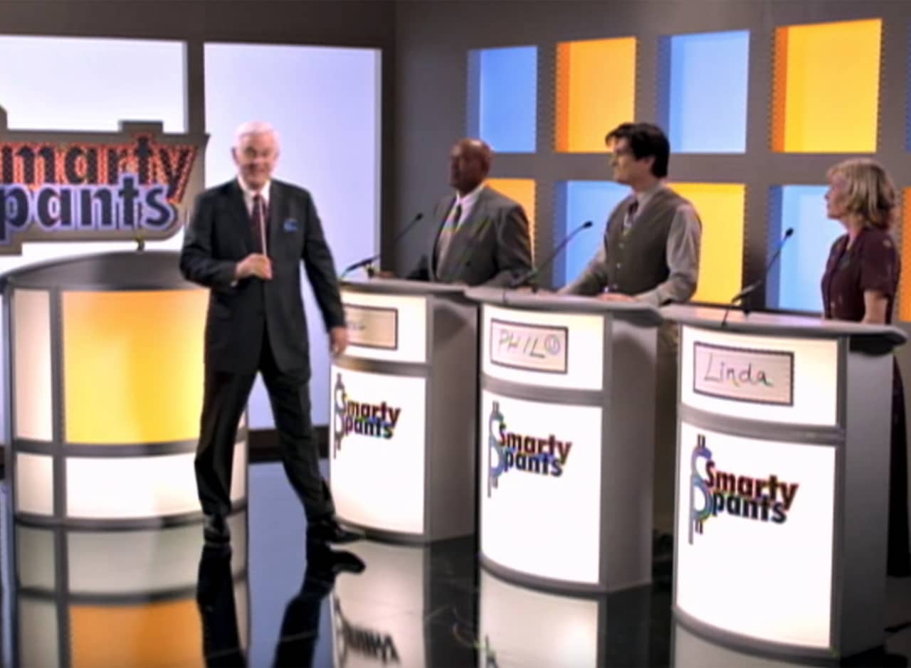 the set of Smarty Pants with the host and three contestants