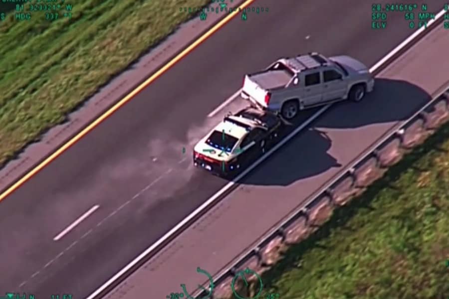 cop car crashing into the back of a truck