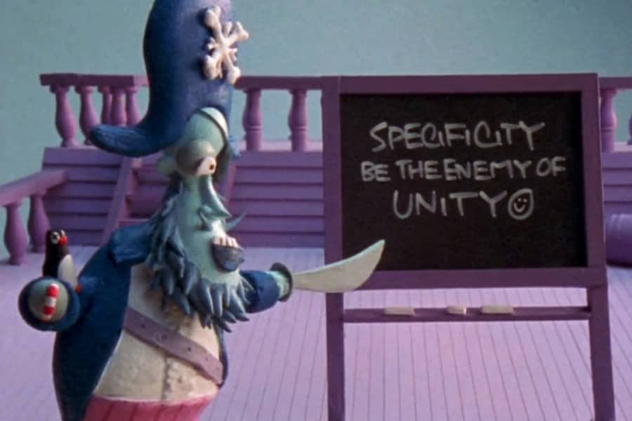 Snowflake Jake pointing at a blackboard that says “Specificity be the enemy of unity”