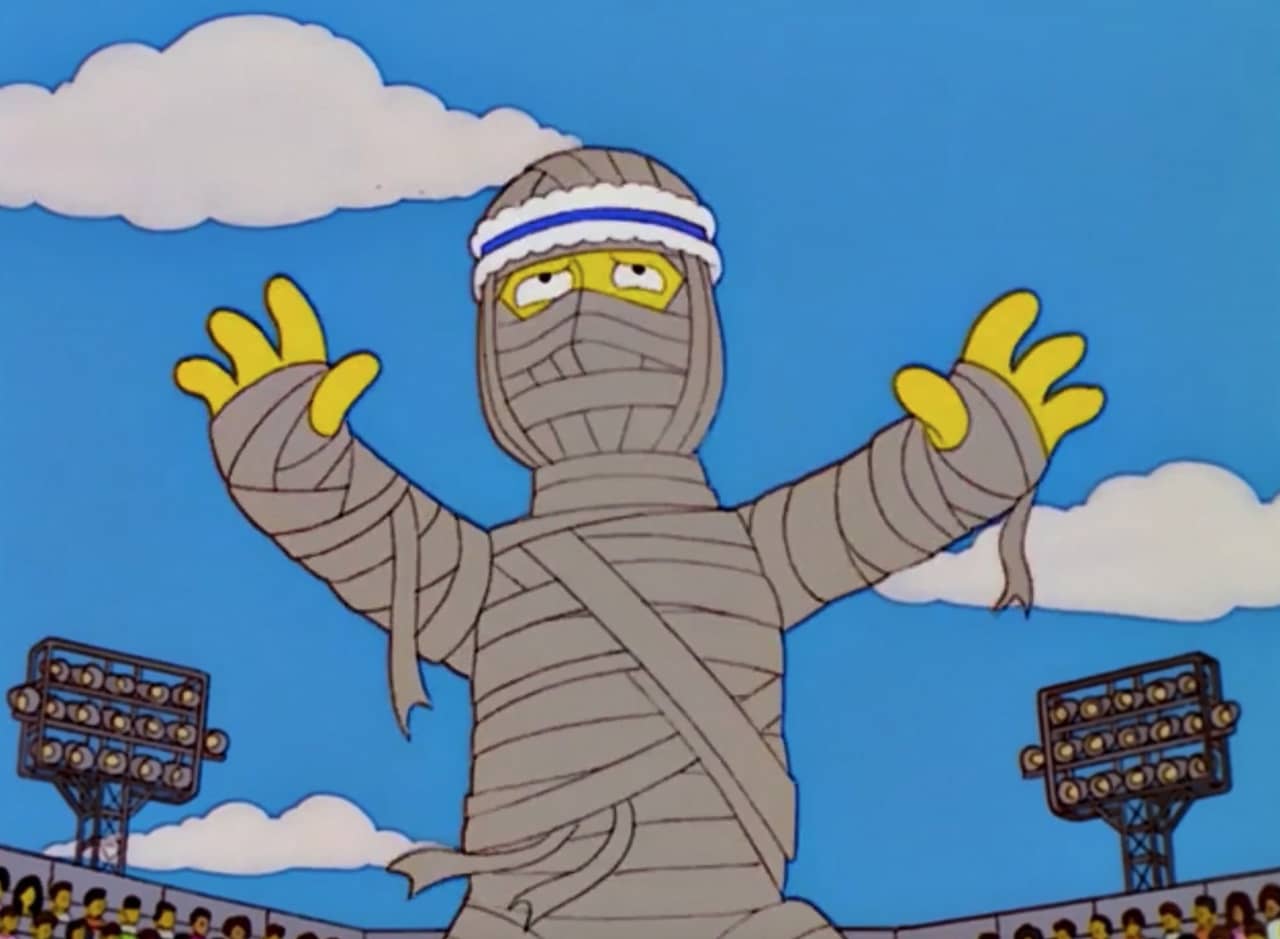 a mummy with a sweatband in a soccer stadium