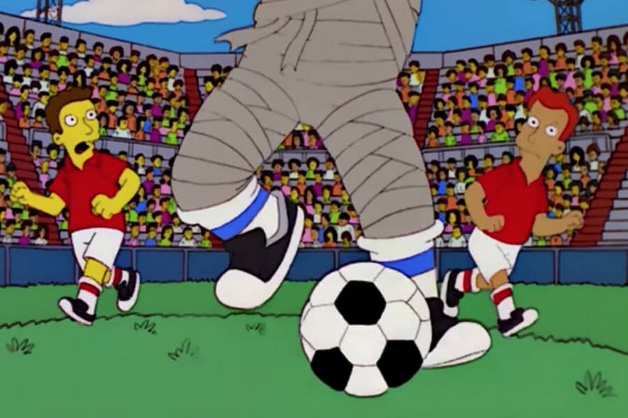 the mummy’s feet dribbling a soccer ball as other players try to keep up