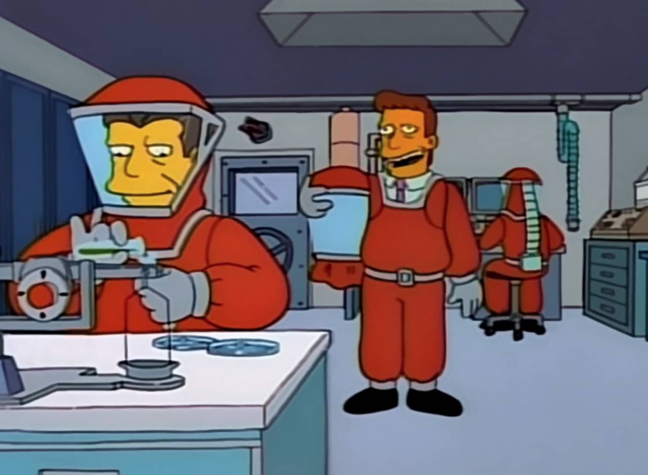 Troy McClure in a hazmat suit in a science lab