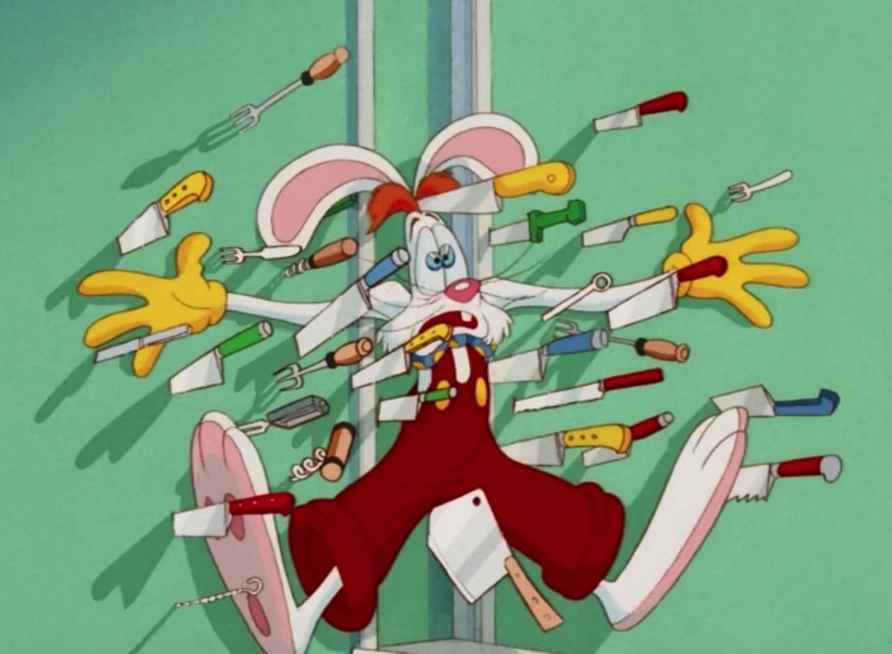 Roger Rabbit splayed against a wall surrounded by knives, forks, and corkscrews stuck in the wall