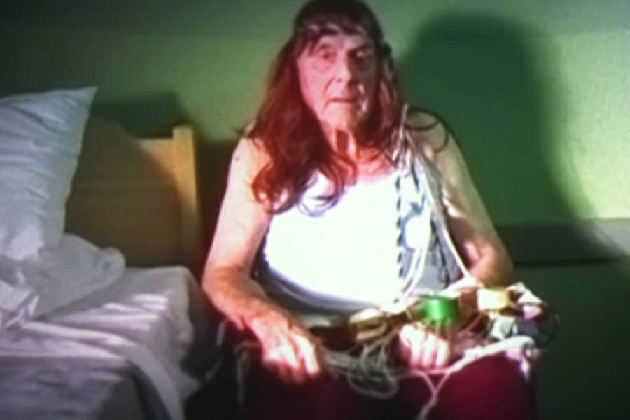 an old man tied up with a fake bomb