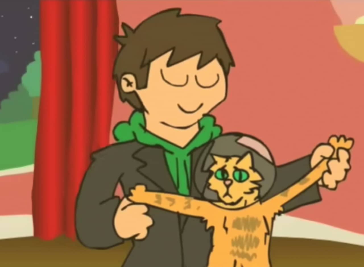 Edd dancing with a cat in a space helmet