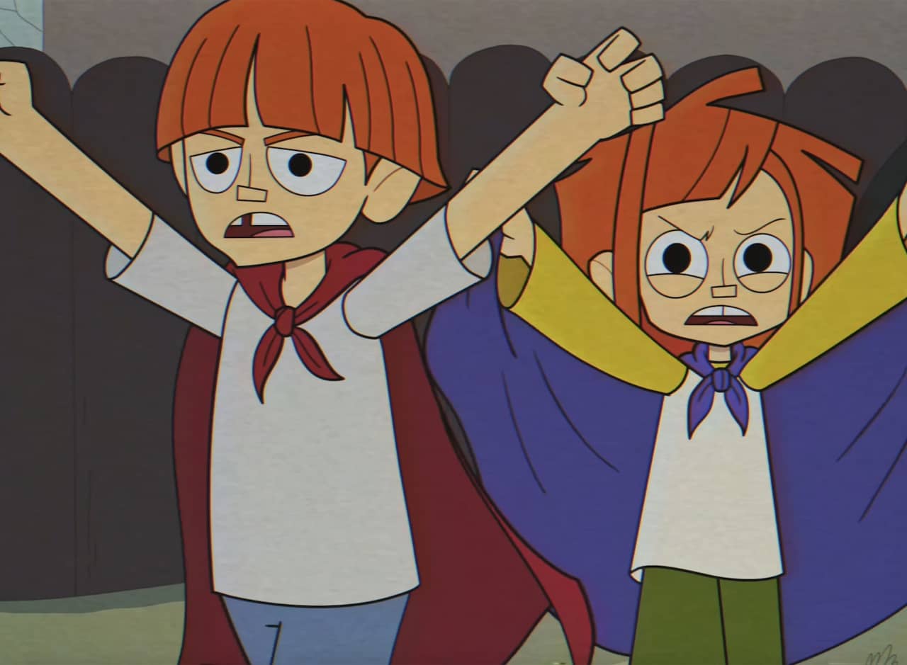 young Reggie and Dustin with vampire capes
