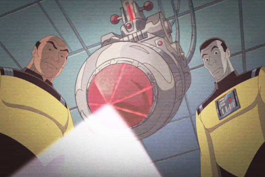 crew members next to a giant laser