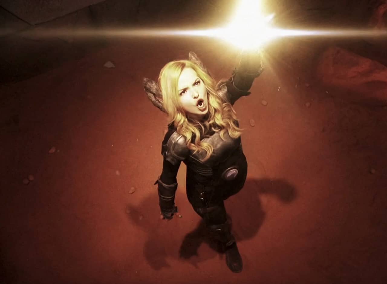 Liv Rooney as Tristan Lycanth projecting a light beam into the sky