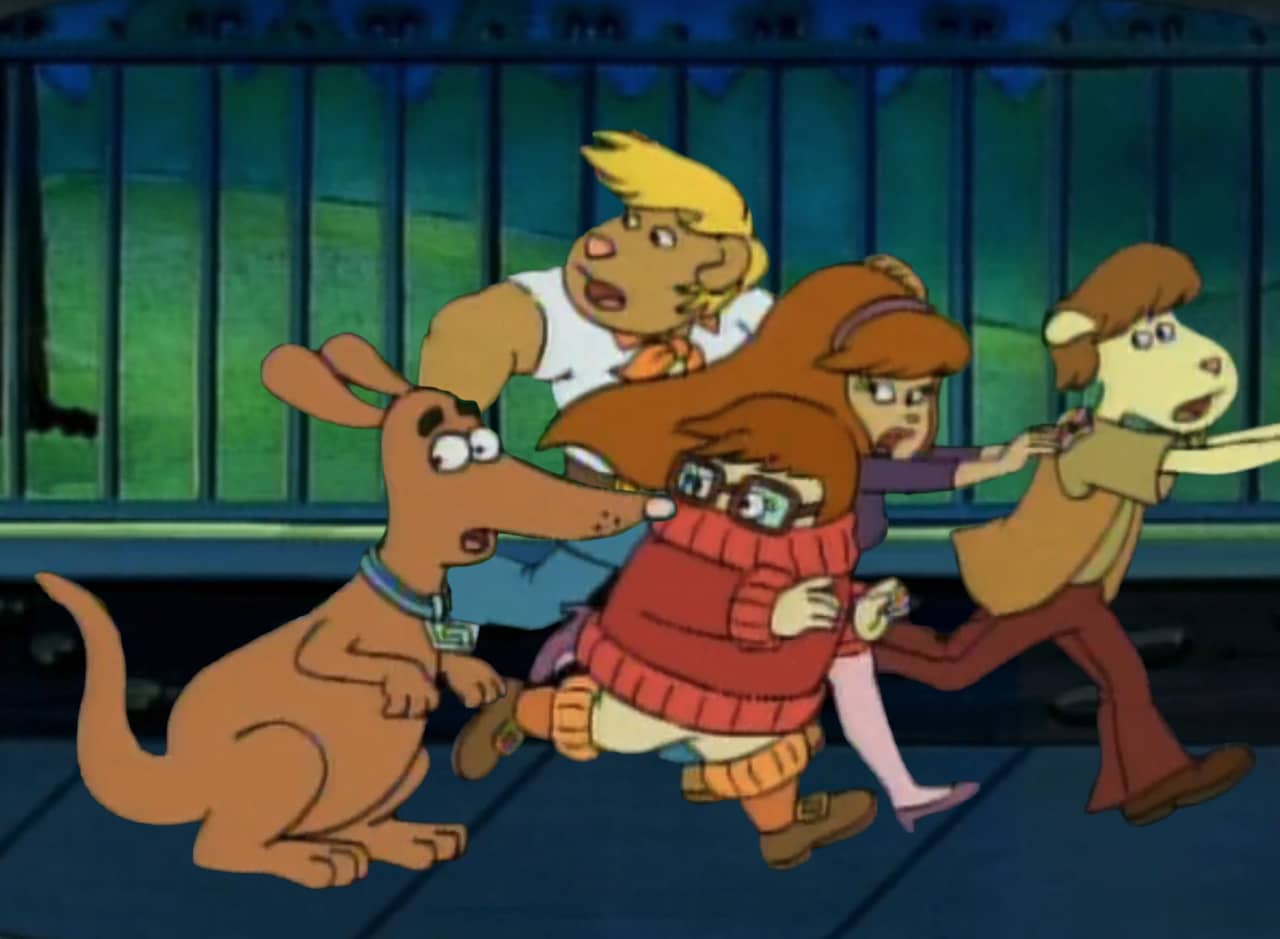 the gang: two guys and two girls running away with a Spooky Poo, their kangaroo