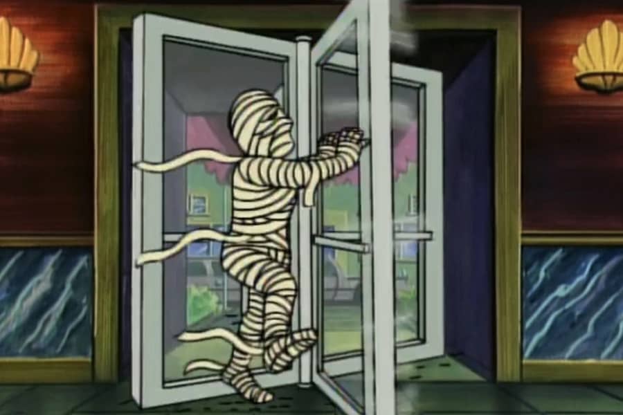 a mummy running through a revolving door