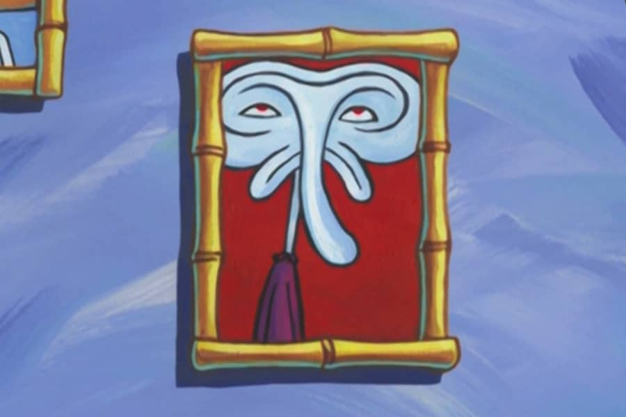 a framed photo on the wall of a surrealist self portrait