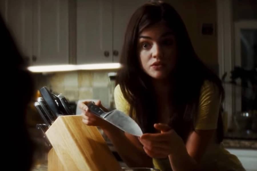 Hale talks in the kitchen, holding a knife in her hands