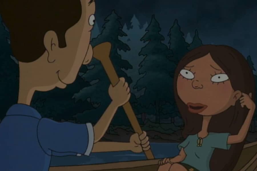 the girl tucks her hair behind her ear
