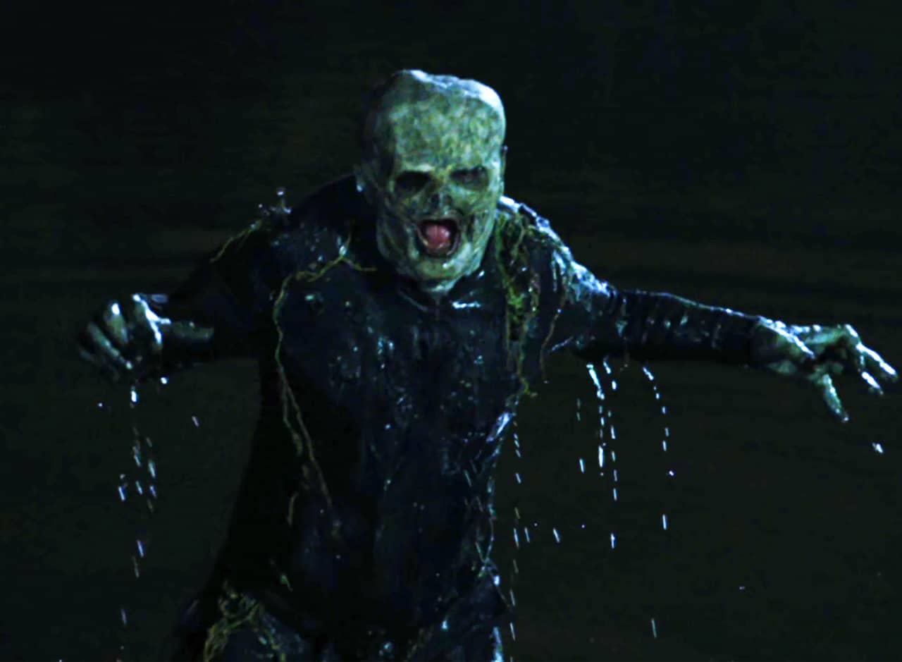 swamp monster coming out from the water