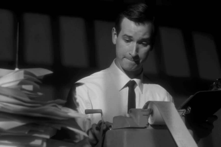 white man doing accounting work