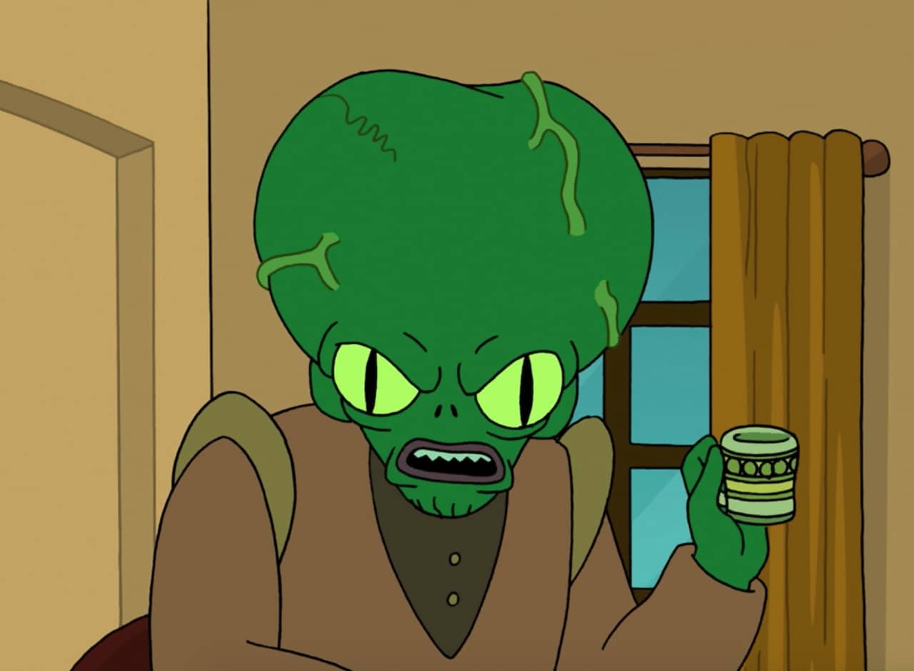 Morbo holding a tea cup