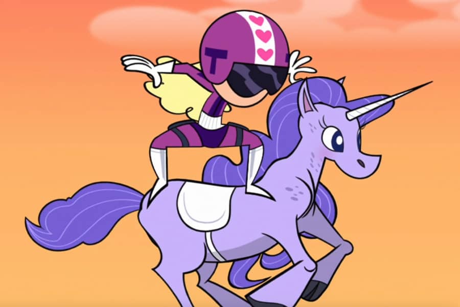 Teena wearing a helmet and standing on the back of a unicorn