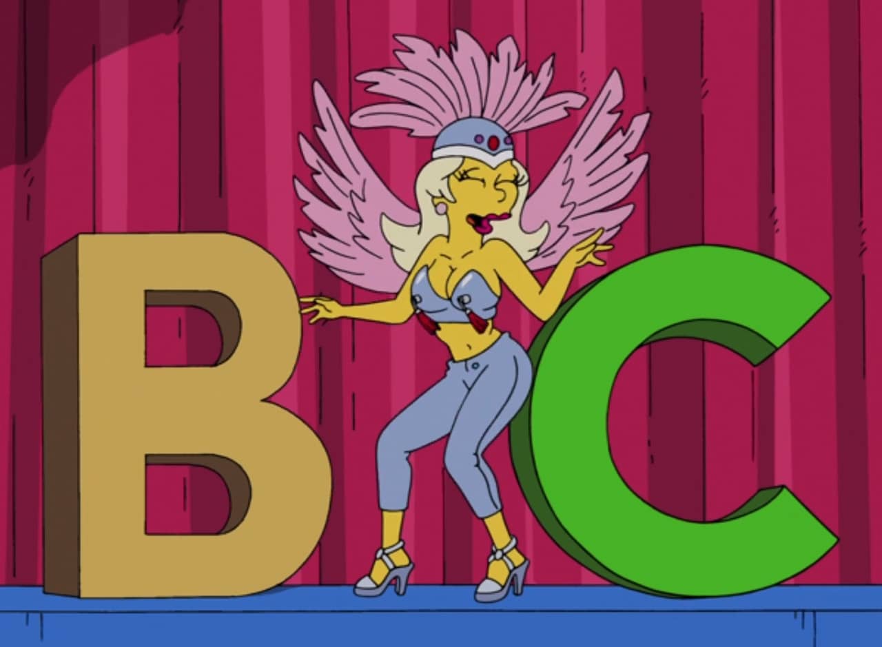 jovial woman, Xoxchitla, in feathered headdress and tassled bodice dances between a giant letter B and C