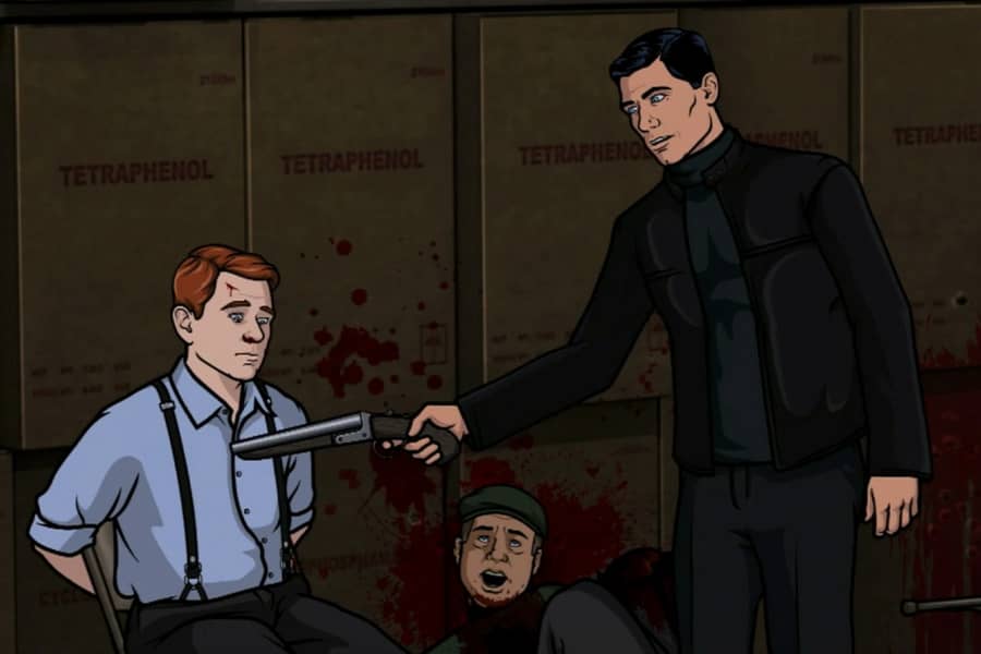Archer points a gun at another mobster