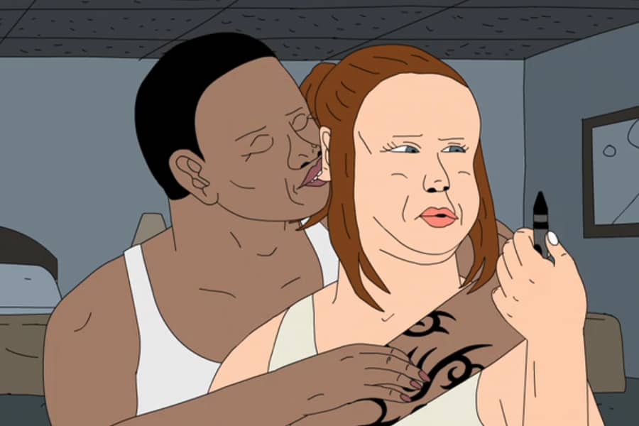 the woman’s partner nibbles on her ear from behind while she holds up a crayon