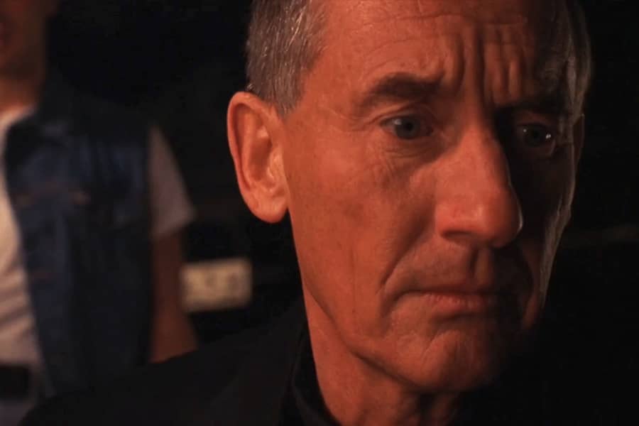 Father Bryson looks sad