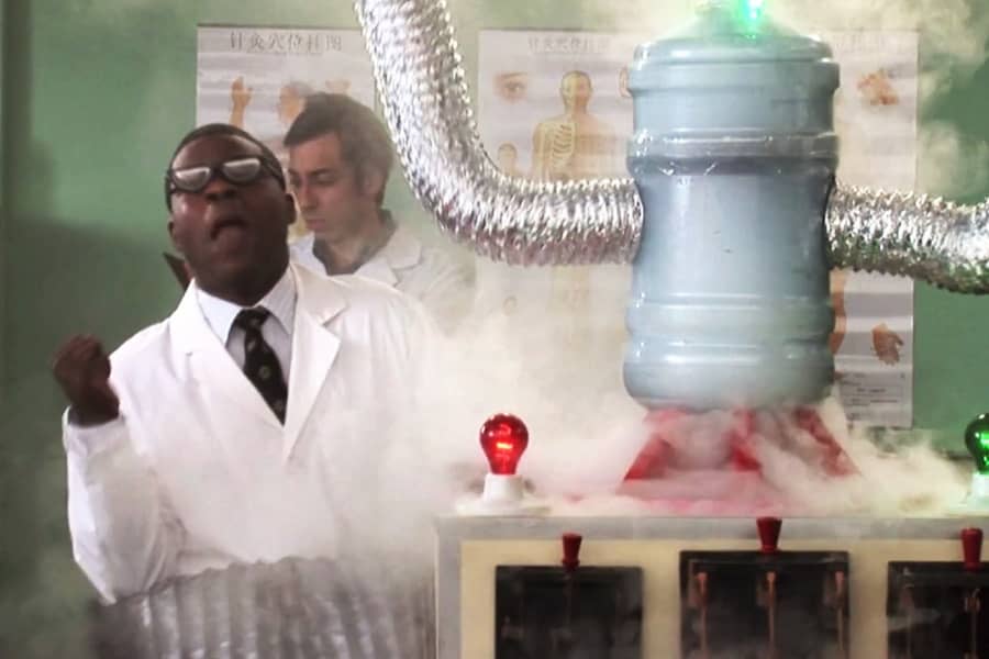 Jordan as a scientist, yells “Noo!” as his robot machine smokes