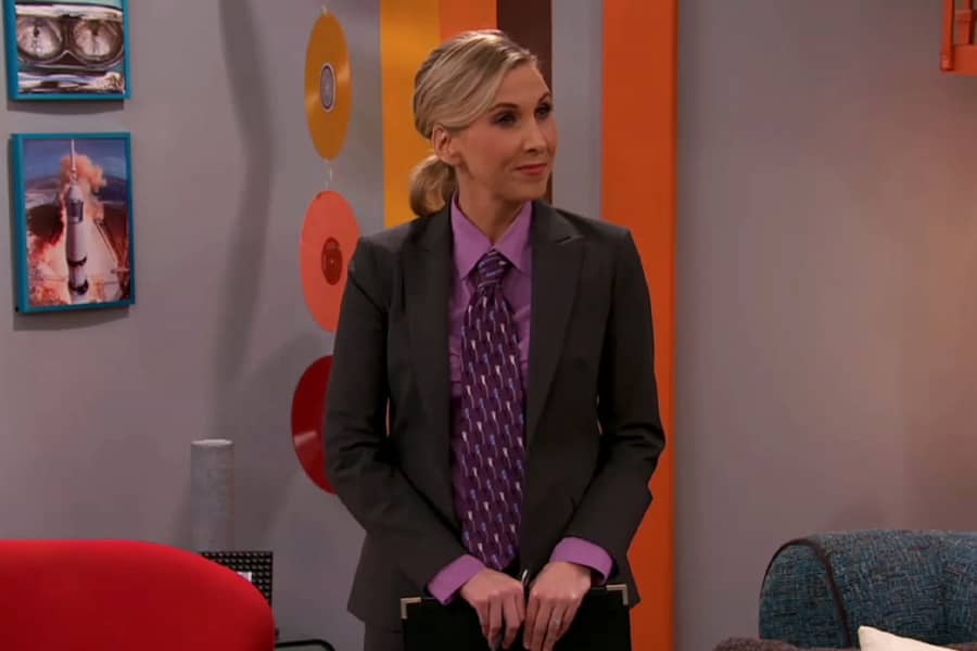 mom in a purple dress shirt and tie