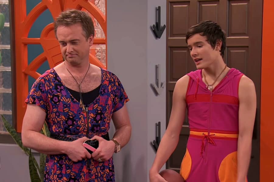 dad and teenage son, both in dresses