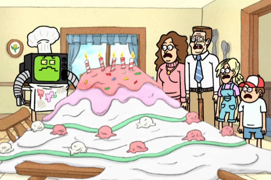 RGB2 and the family aghast next to a humongous, melted cake