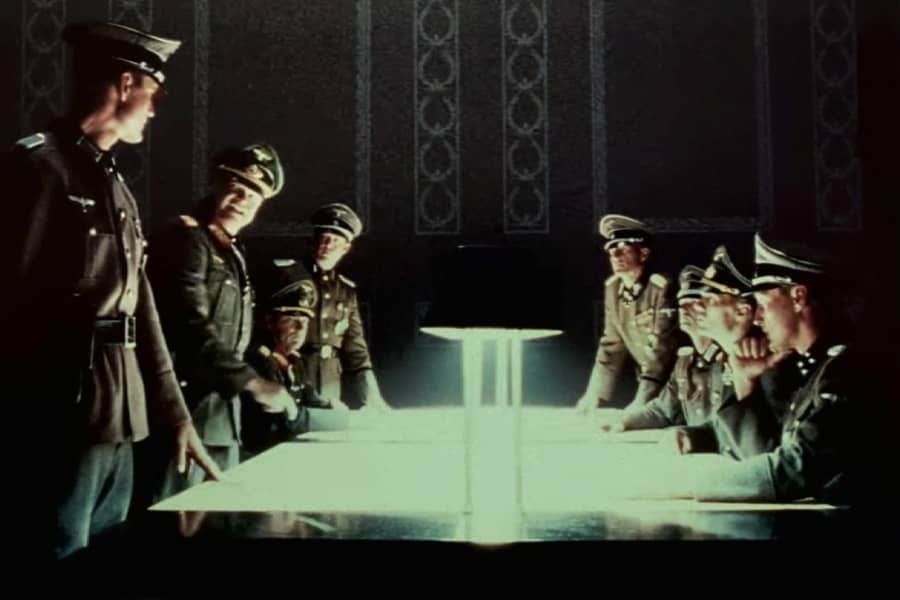 a group of Nazis talking around a table