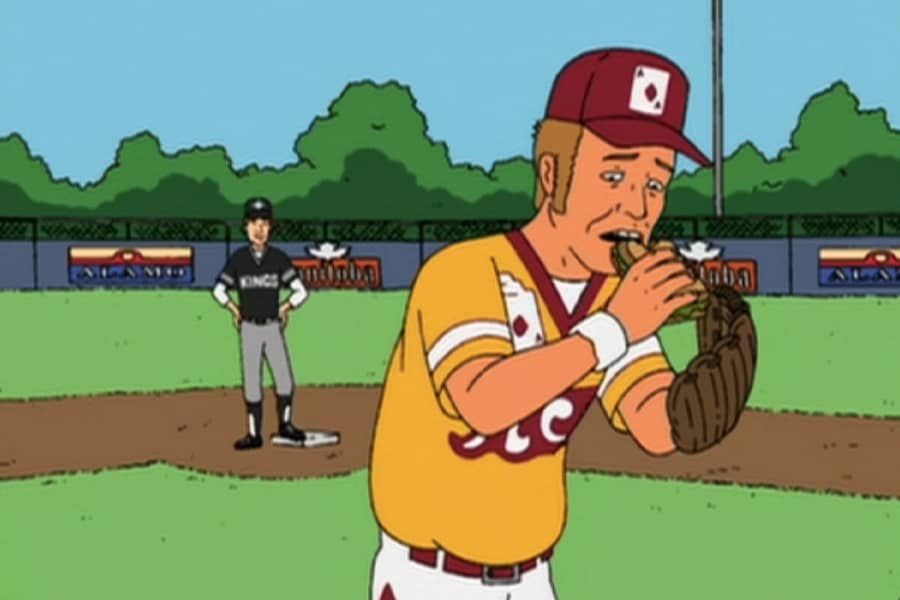 The Ace eating a sandwich on the field