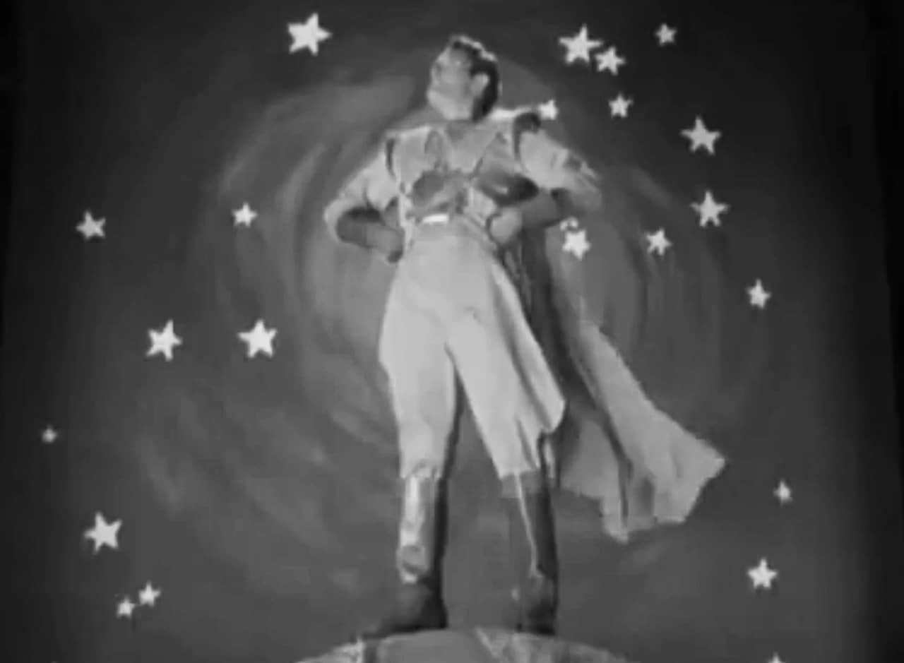 Captain Zoom in superhero pose against the stars