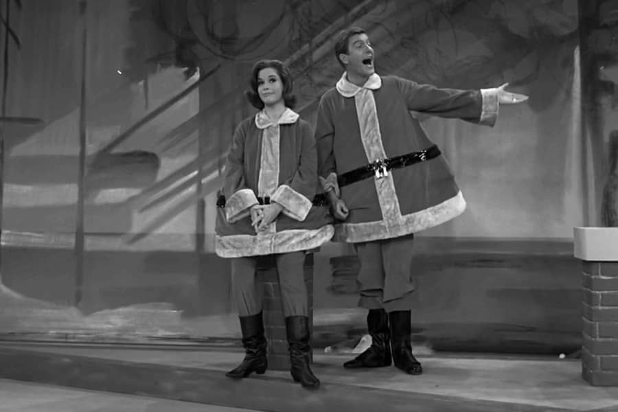 Robert and Laura Petrie in oversized Santa costumes