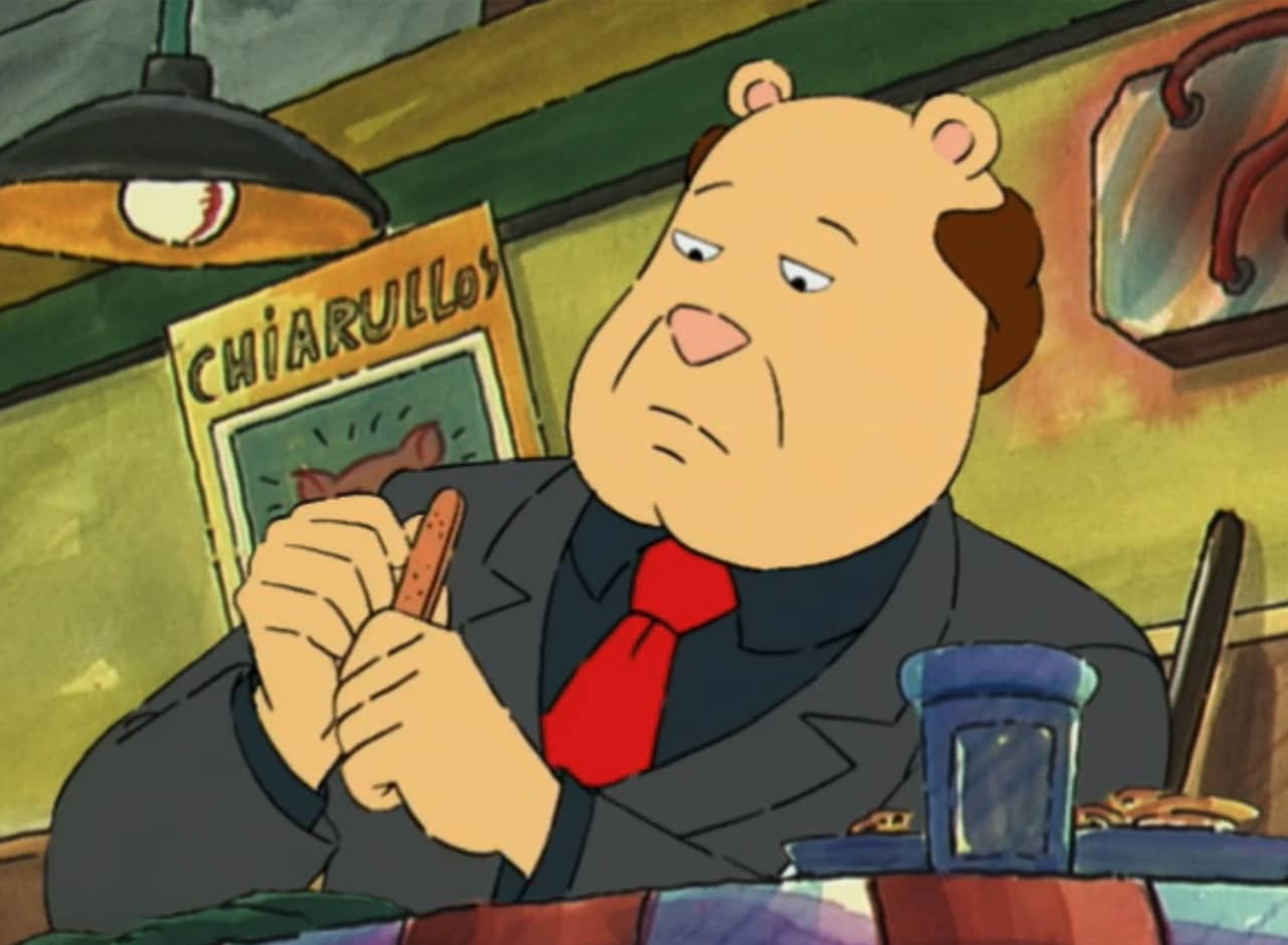 gangster filing his nails at a dinner table of an Italian restaurant