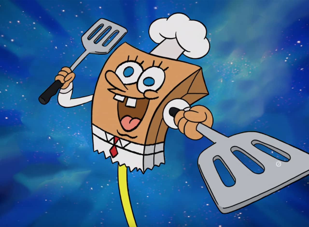 paper bag puppet of SpongeBob with chef hat and spatulas