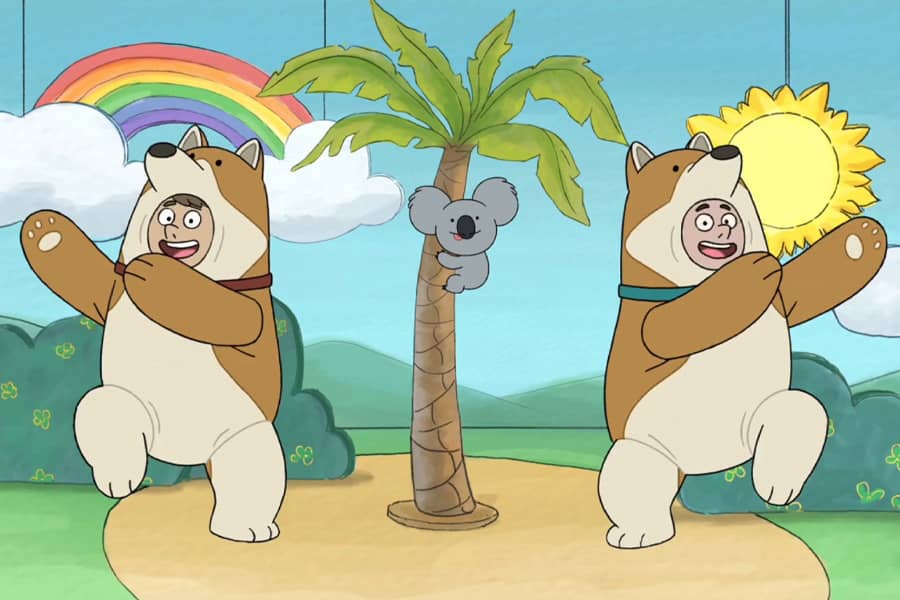the Corgis dancing around a palm tree with Nom Nom the koala on it