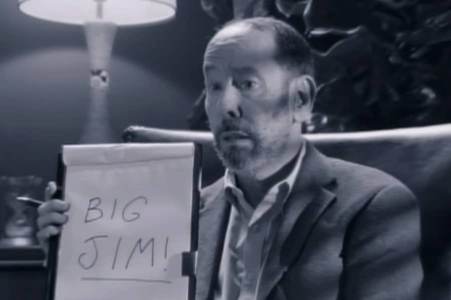 the therapist holds up a paper with “Big Jim!” written on it