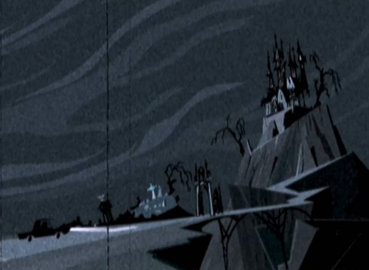 car approaching a hill with a spooky looking house